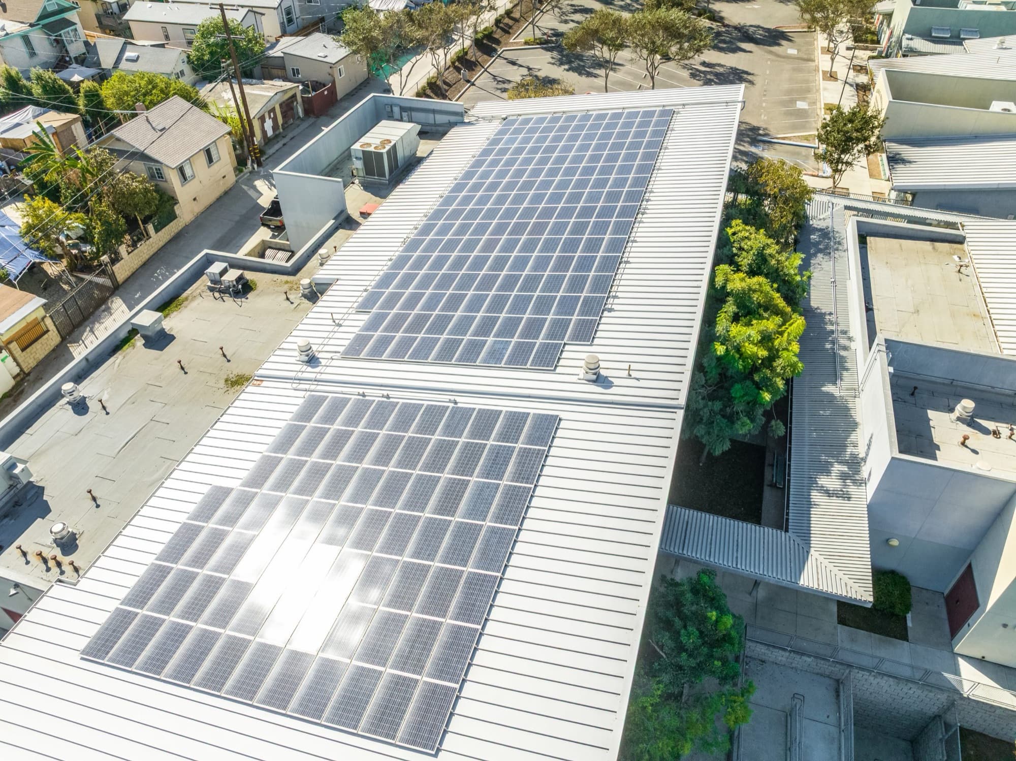 Custom-engineered commercial solar array on a flat roof in San Diego